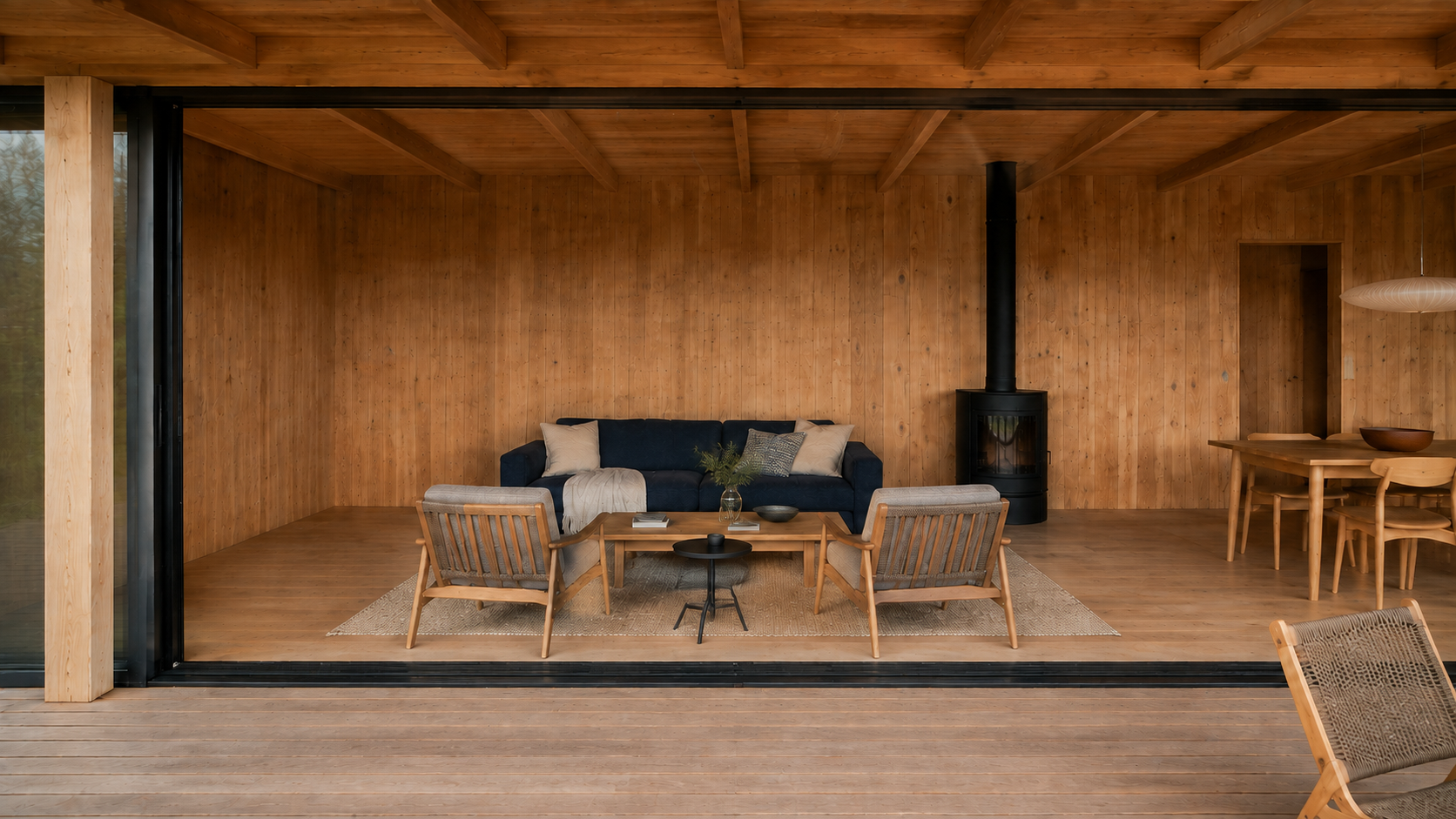From the deck, the straight threshold frames the seating, black stove and passage to the hall. AI-generated Concept.